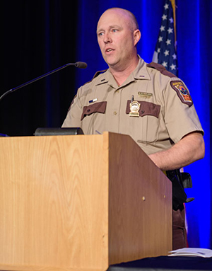 Lt. Brad Norland, Minnesota State Patrol, stands at lectern to accept the Enforcement Star Award at the 2017 Toward Zero Deaths conference Oct. 26. Norland is a leader in promoting traffic safety in the northwest region of the state.